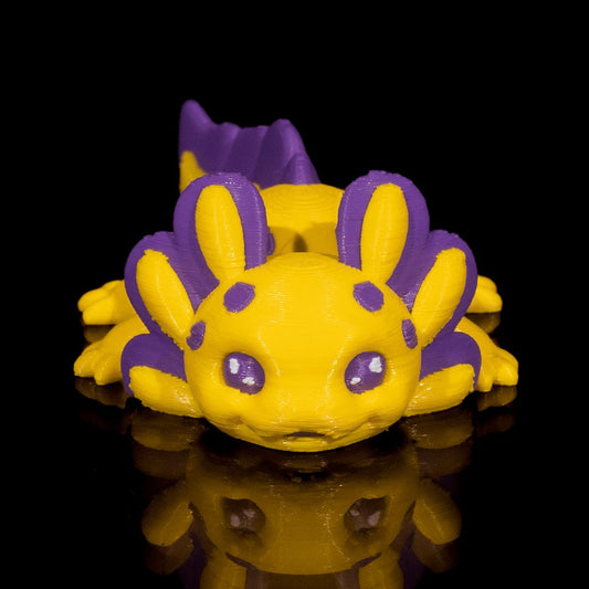 "Banana Cup Axolotl 3D-Figur mit fröhlichem, verspieltem Gesichtsausdruck, fruchtiger Spaßvogel und Mini-Genießer im 7g Miniformat"Gecko3d