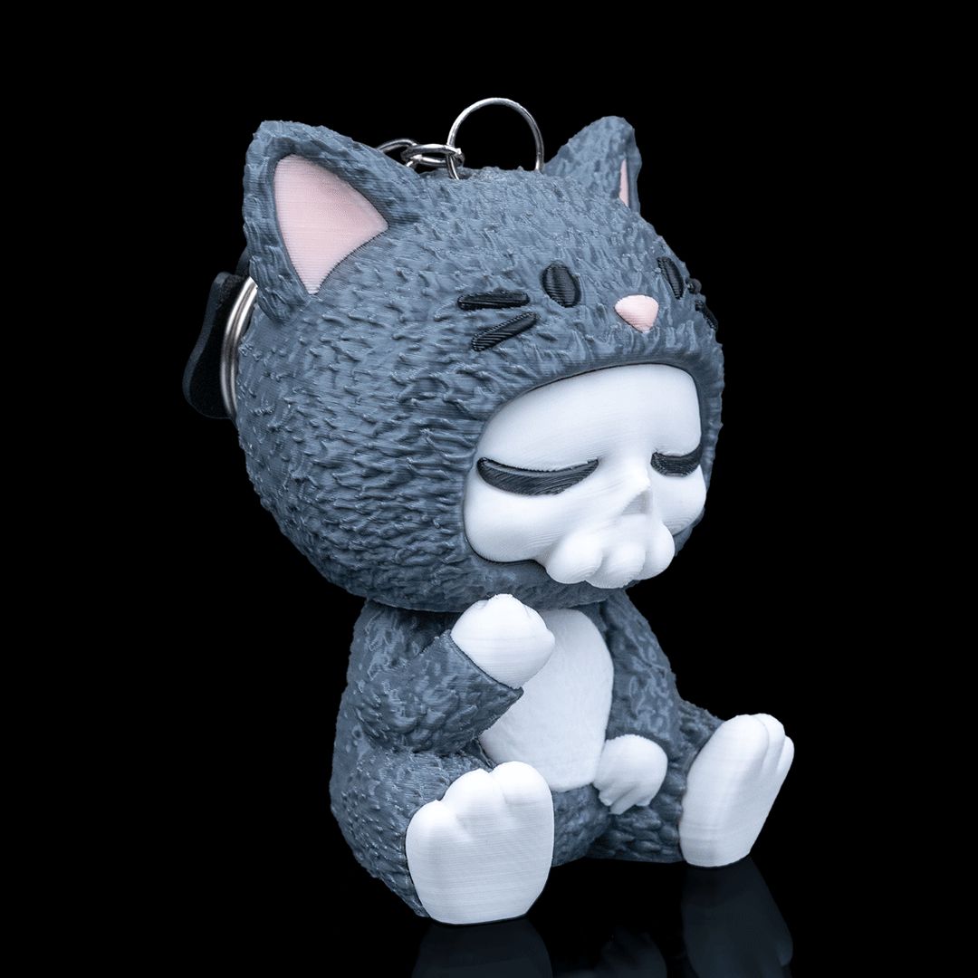 Whispurr Katzen Skubbie - Entspannte 3D Sammelfigur mit halb geschlossenen Augen aus nachhaltigem PLA als Deko oder Taschenanhänger von Gecko3D